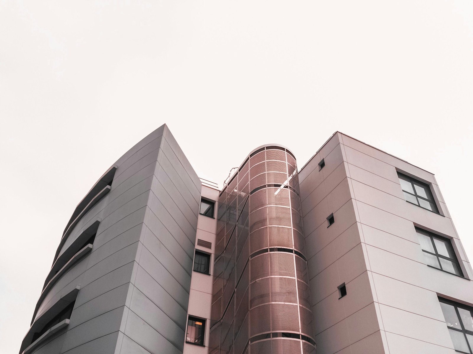 low angle photography of brown and white concrete building