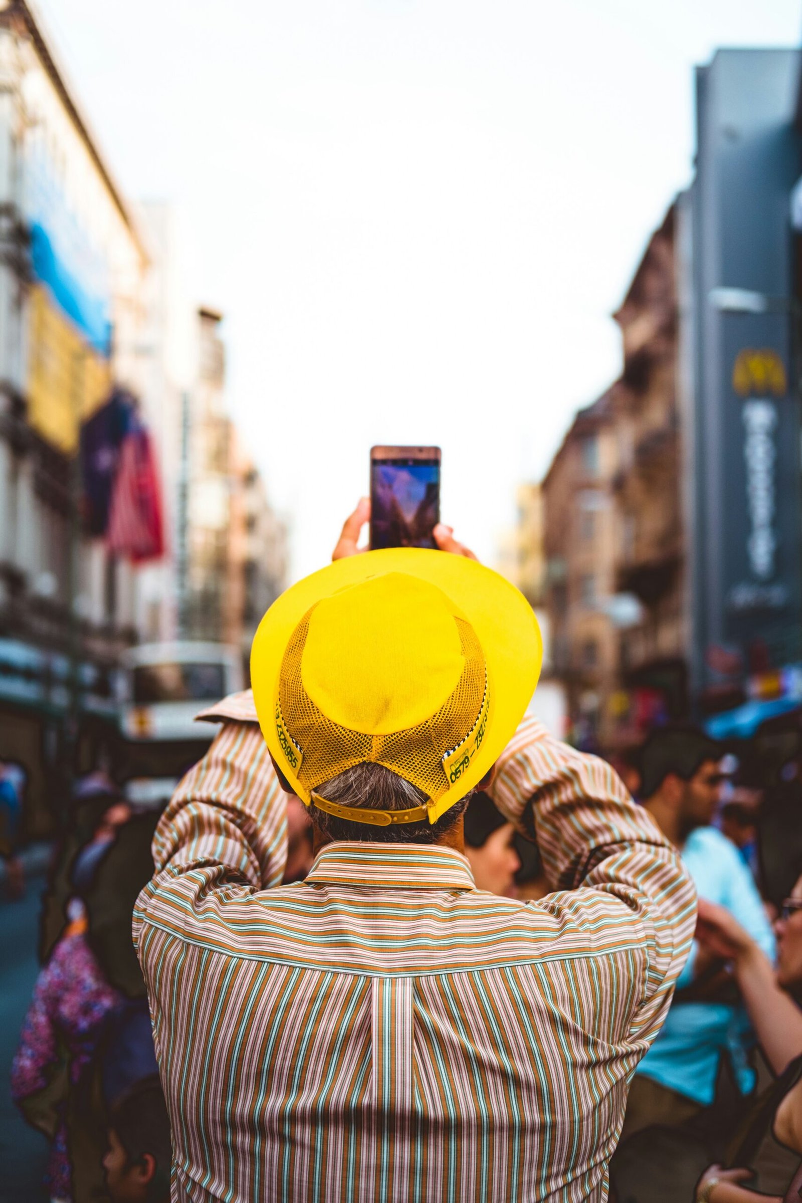 man taking picture near people at daytime