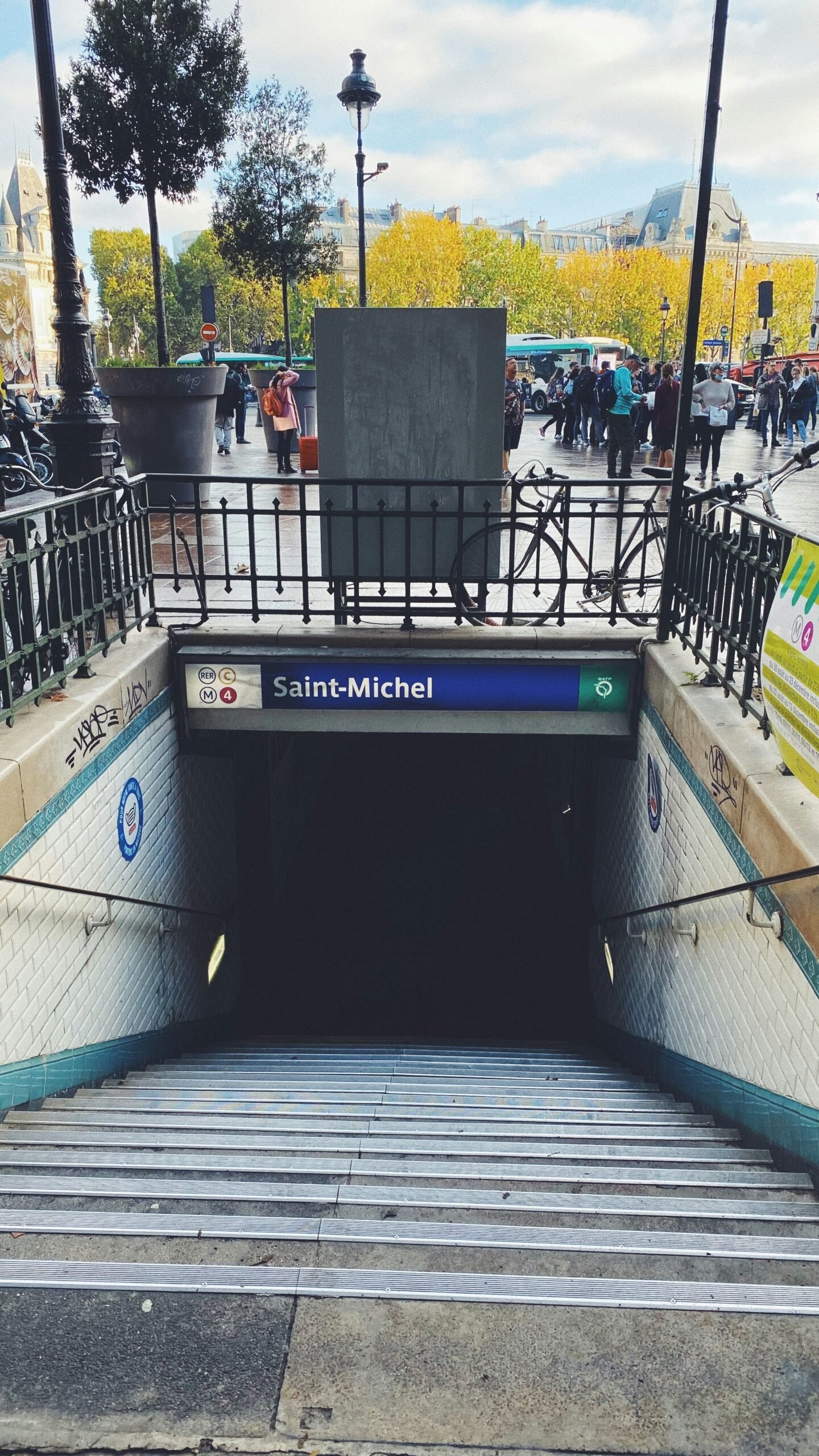 the entrance to a subway station with stairs leading up to it