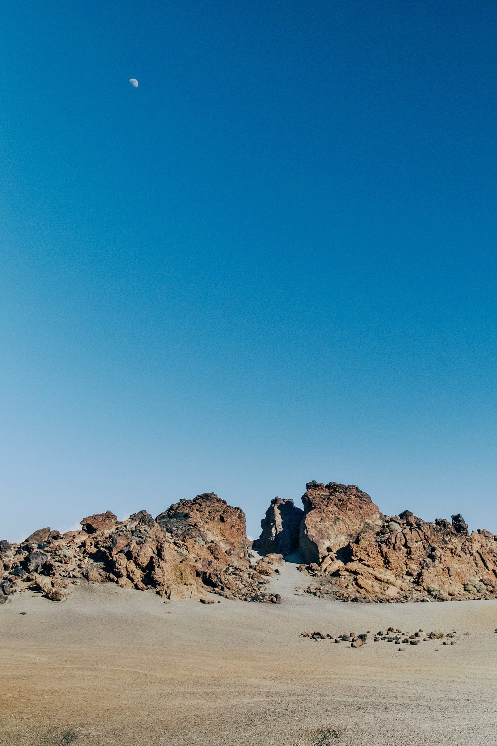 a large rock formation in the middle of a desert