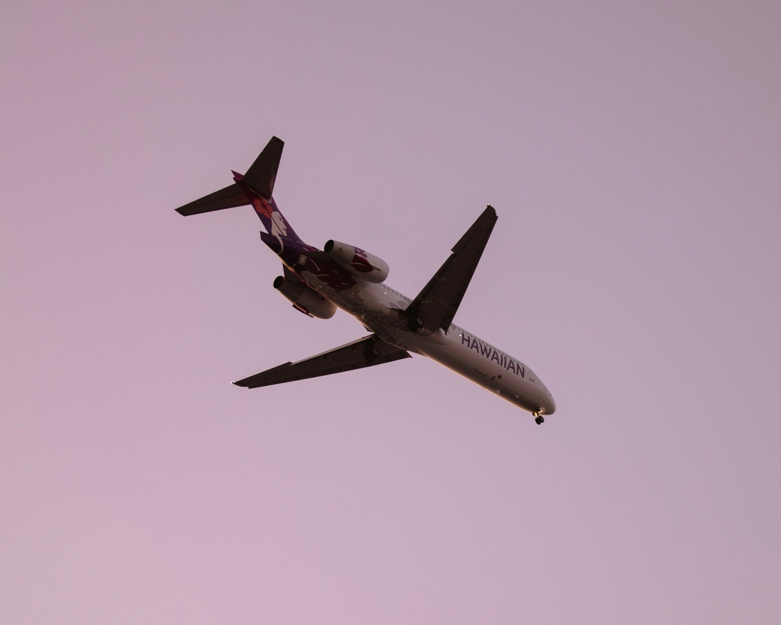 an airplane is flying in the sky on a clear day